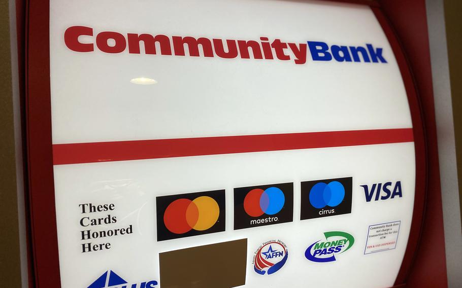 A Bank of America logo is covered on a Community Bank ATM at the Navy-run New Sanno Hotel in Tokyo, Tuesday, April 9, 2024.