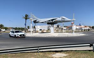A car travels in a roundabout near one of the gates at Naval Station Rota, Spain, in August 2022. The base recently reintroduced a points system to penalize drivers for a range of traffic violations.