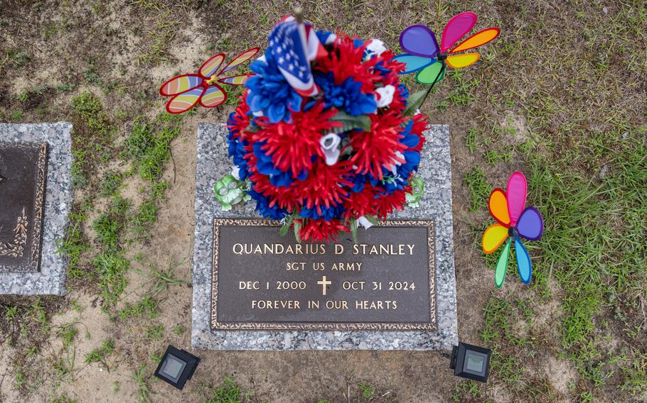 Flowers adorn a grave marker.