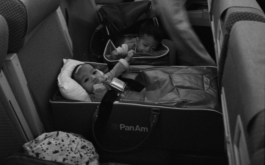 Nurses and Vietnamese refugee children on an Operation Babylift Flight upon arrival at San Francisco International Airport, April 5, 1975. 