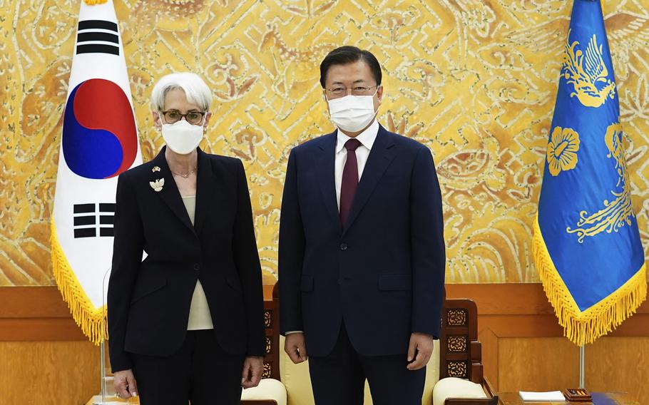South Korean President Moon Jae-in and U.S. Deputy Secretary of State Wendy Sherman pose for photos prior to their meeting at the presidential Blue House in Seoul, South Korea, Thursday.