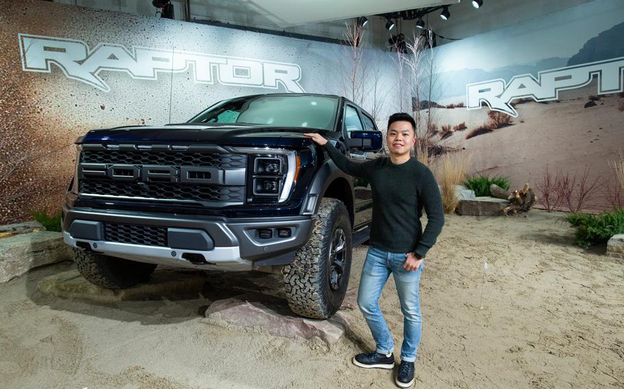 Tom Liu, lead exterior designer for the 2021 Ford F-150 Raptor, stands beside the vehicle in a design studio in Livonia, Mich., in January 2021. With gasoline topping $6 a gallon at some Los Angeles-area stations, motorists and especially heavy-duty truck owners are feeling the pinch.
