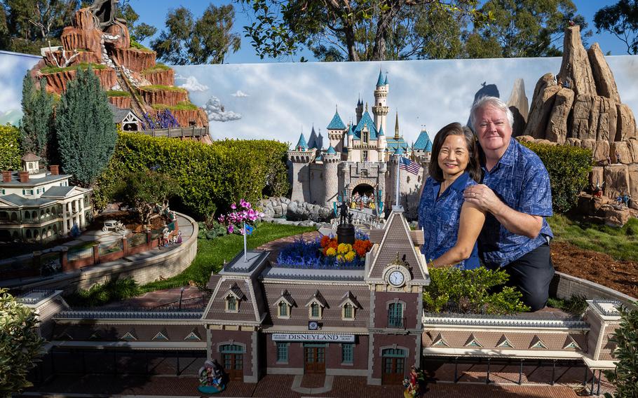 Architects David and Frances Sheegog pose with their mini Disneyland in their Anaheim Hills backyard, Jan. 11 in Anaheim, Calif. 