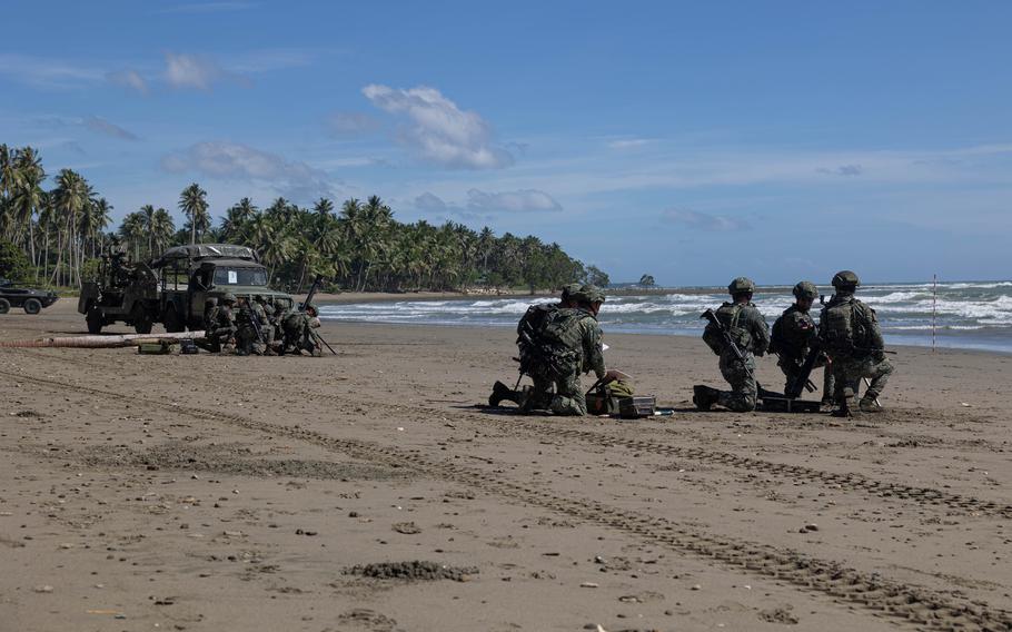 Members of the Philippines’ 3rd Marine Brigade practice defending Kamuning beach in Palawan on Nov. 16.