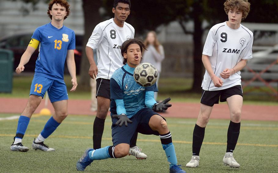 Zama goalkeeper Marques Cuffie snags a Yokota corner kick during Thursday's All-DODEA-Japan boys soccer tournament. The teams battled to a 1-1 draw.