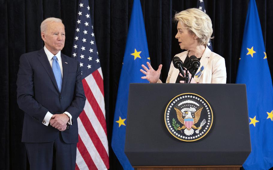 President Joe Biden listens as European Commission President Ursula von der Leyen speaks about the Russian invasion of Ukraine, at the U.S. Mission in Brussels, Friday, March 25, 2022, in Brussels. 