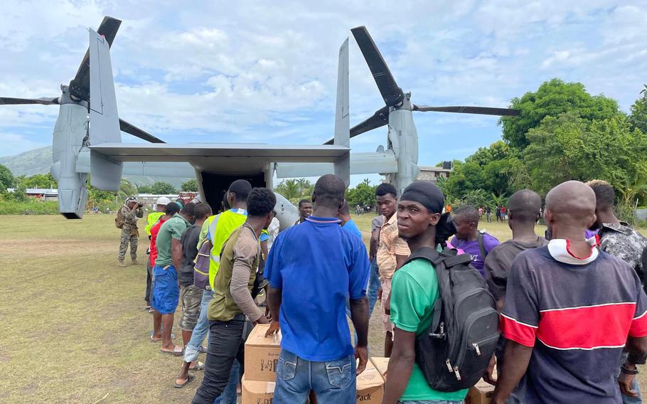 A U.S. military aircraft drops off aid on Friday, August 21, 2021 to Les Anglais, a remote community on Haiti's southern peninsula that was devastated by the August 14, 2021 earthquake. 