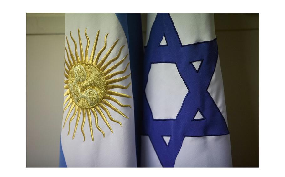 An Argentine and Israeli flag stand side by side at the office of Guillermo Borger, president of the Jewish community center AMIA, during an interview in Buenos Aires, Argentina, on Feb. 8, 2013. Argentina’s highest criminal court on Thursday, April 12, 2024, reported a new development in the elusive quest for justice in the country’s deadliest attack in history – the 1994 bombing of a Jewish community center headquarters – concluding Iran had planned the attack and Lebanon’s Hezbollah militant group had executed the plans.