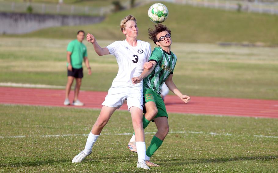 Benjamin Delaney and Jayden Villatoro try to get possession.