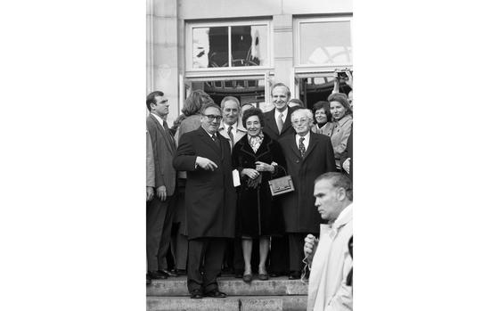 Fuerth, Germany, December 15, 1975: U.S. Secretary of State Henry Kissinger stands on the steps of Fuerth's City Theater with his mother, Paula and father, Louis by his side. Kissinger's brother Walter (l) and the Fuerth's Lord Mayor Kurt Scherzer stand in the row behind them. Kissinger visited his former hometown in Germany to receive the city's highest reward - the Golden Citizen's Medallion - for his efforts to achieve peace in the world.  The Kissinger family left the Bavarian town in 1938 after Mr. Kissinger's father, Louis Kissinger was forced to quit his job as Jews were barred from teaching positions across Germany. The elder Kissinger, his wife and two children fled to the United States.

Looking for Stars and Stripes’ historic coverage? Subscribe to Stars and Stripes’ historic newspaper archive! We have digitized our 1948-1999 European and Pacific editions, as well as several of our WWII editions and made them available online through https://starsandstripes.newspaperarchive.com/


META TAGS: Europe; West Germany; German American relations; diplomacy; Jewish history; diplomacy; foreign relations; dignitaries; ceremony