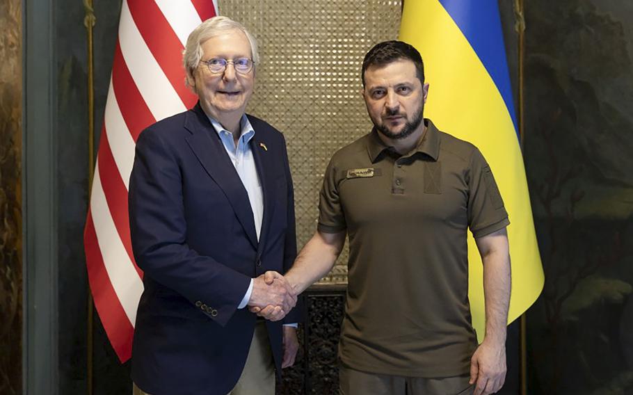 Ukrainian President Volodymyr Zelenskyy and Senate Minority Leader Mitch McConnell, R-Ky., pose for a photo in Kyiv, Ukraine, Saturday, May 14, 2022. 