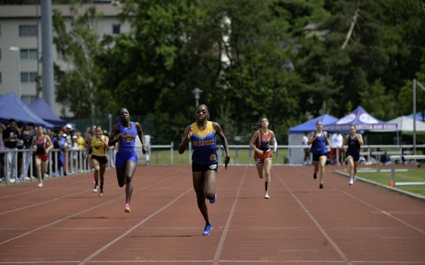 Makiah Parker, a senior at Wiesbaden High School, crosses the finish line with a commanding lead to win the girls 400 meter varsity dash at the 2024 DODEA European Championships at Kaiserslautern High School in Kaiserslautern, Germany, on May 24, 2024.