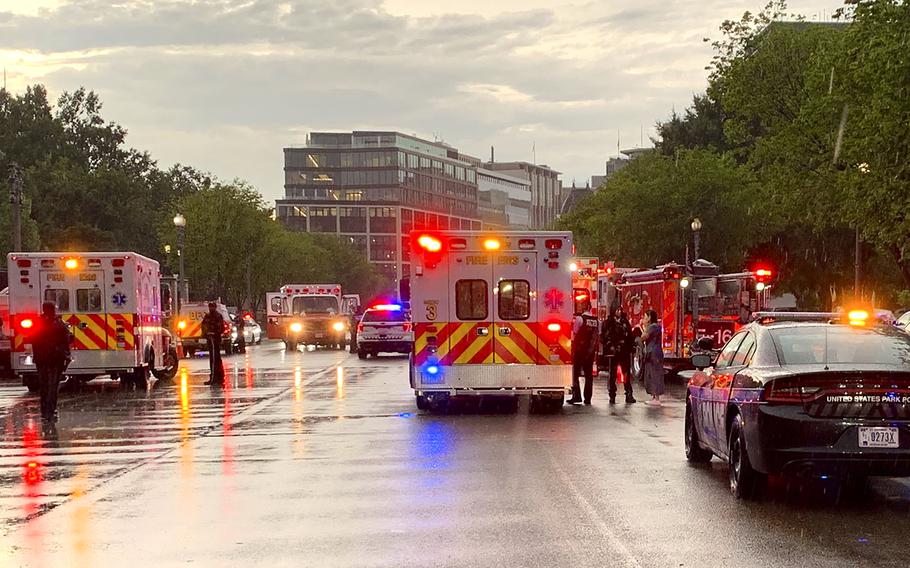 Emergency medical crews are staged on Pennsylvania Avenue between the White House and Lafayette Park, Thursday evening, Aug. 4, 2022 in Washington. Two people who were critically injured in a lightning strike in Lafayette Park outside the White House have died, police said Friday. Two others remained hospitalized with life-threatening injuries. Authorities haven't revealed how the people were injured, other than to say they were critically hurt in the lightning strike.