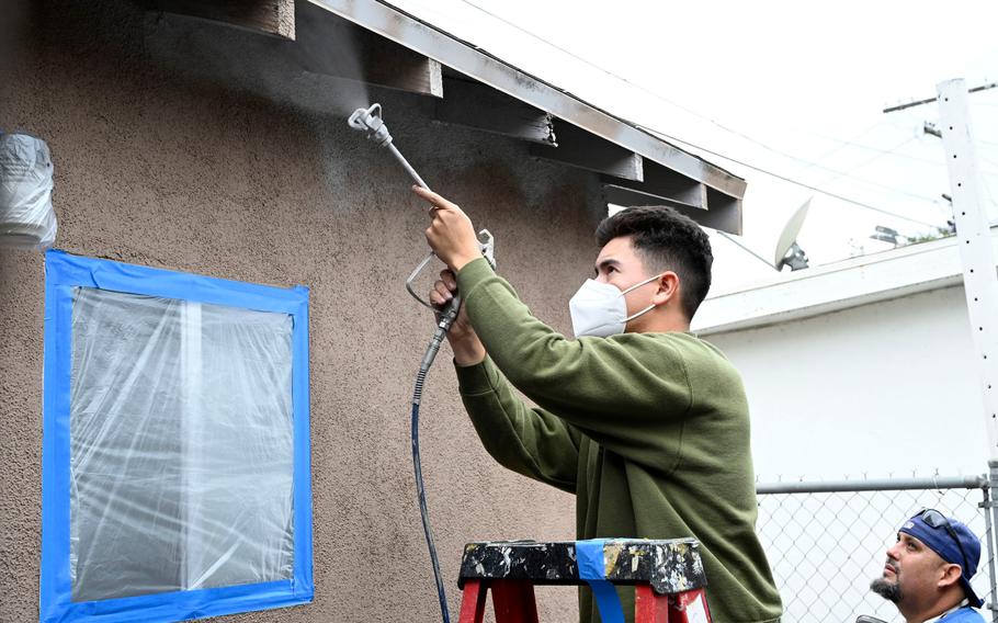 Active-duty sailors and Marines visiting Los Angeles for LA Fleet Week volunteer their time at organizations throughout the Los Angeles area, including repairing the home of a Vietnam-era veteran, with Habitat for Humanity, in Los Angeles on May 27, 2022. 