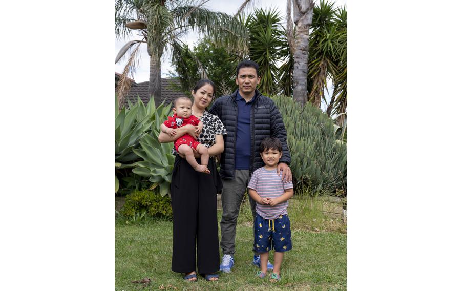 Noor Mohammad Ramazan, 33, with wife Masuma Panahi, 28, and their children Daniel, 5, and Diana, 7 months, at Ramazan's cousin's home in Melbourne, Australia. 