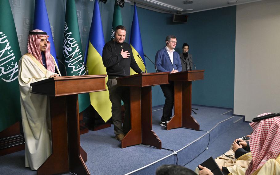 Saudi Arabia’s Minister of Foreign Affairs Prince Faisal bin Farhan Al-Saud, left, Head of the Office of the President of Ukraine Andriy Yermak, center, and Foreign Minister of Ukraine Dmytro Kuleba, second from right, attend a joint press conference in Kyiv on Feb. 26, 2023, amid the Russian invasion of Ukraine.