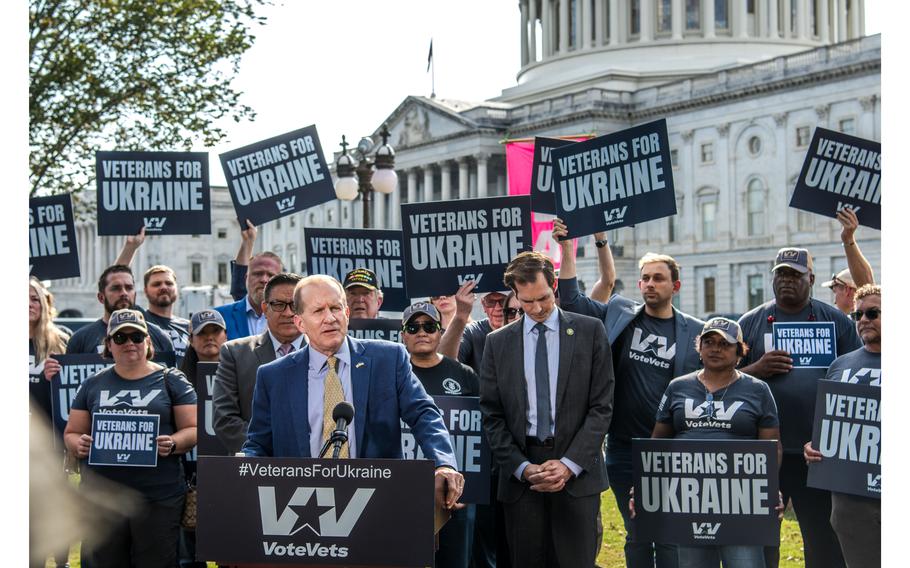 Ret. Army Brig. Gen. Steven Anderson speaks outside the U.S. Capitol on Oct. 3, 2023, calling for continued military support for Ukraine. Behind Anderson holding up signs are veterans for Ukraine demonstrators with VoteVets.org.