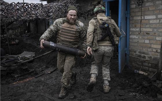 Ukrainian soldiers move ammunition last year on the outskirts of Chasiv Yar, in Donetsk Oblast.