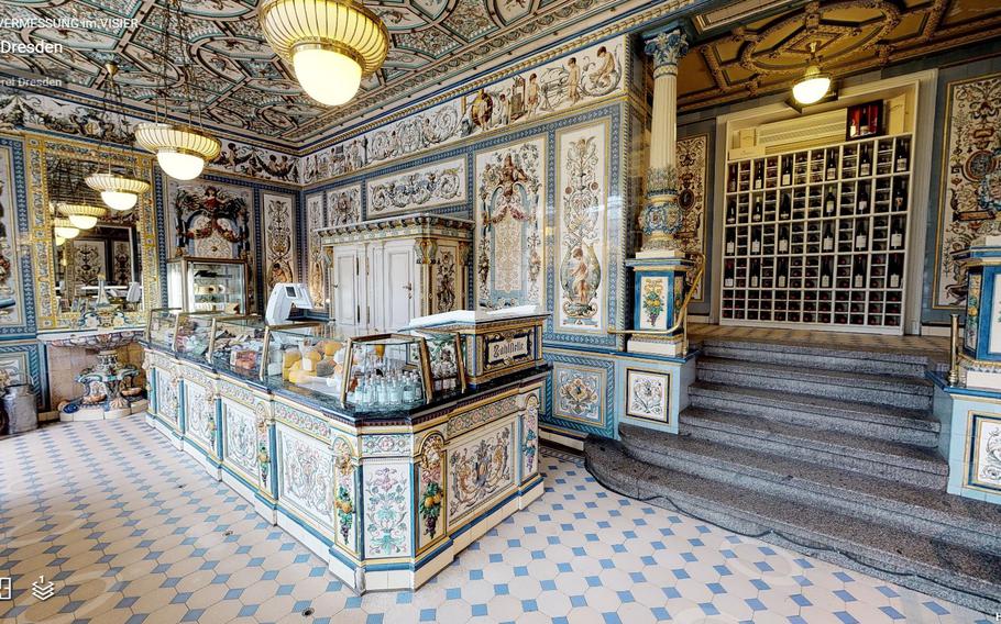 A 3D rendering of the empty Pfunds Molkerei on the company's website shows the ornate decorations of the cheese shop.