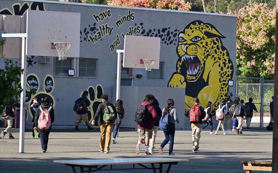 Students walk to their classrooms at a public middle school in Los Angeles, California, on September 10, 2021. 