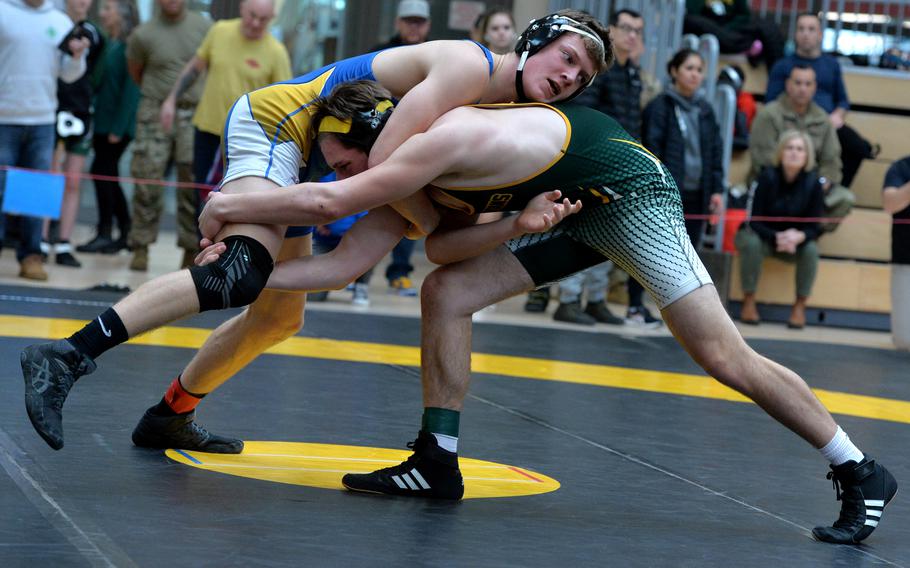 Wiesbaden’s Jens Bishop, left, beat SHAPE’s Rayden Bodine in a 165-pound match on opening day of the DODEA-Europe wrestling finals in Wiesbaden, Germany, Feb. 10, 2023.