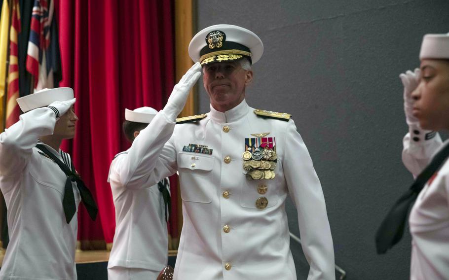 Vice Adm. Karl Thomas salutes after taking command of the 7th Fleet at Yokosuka Naval Base, Japan, Thursday, July 8, 2021. 