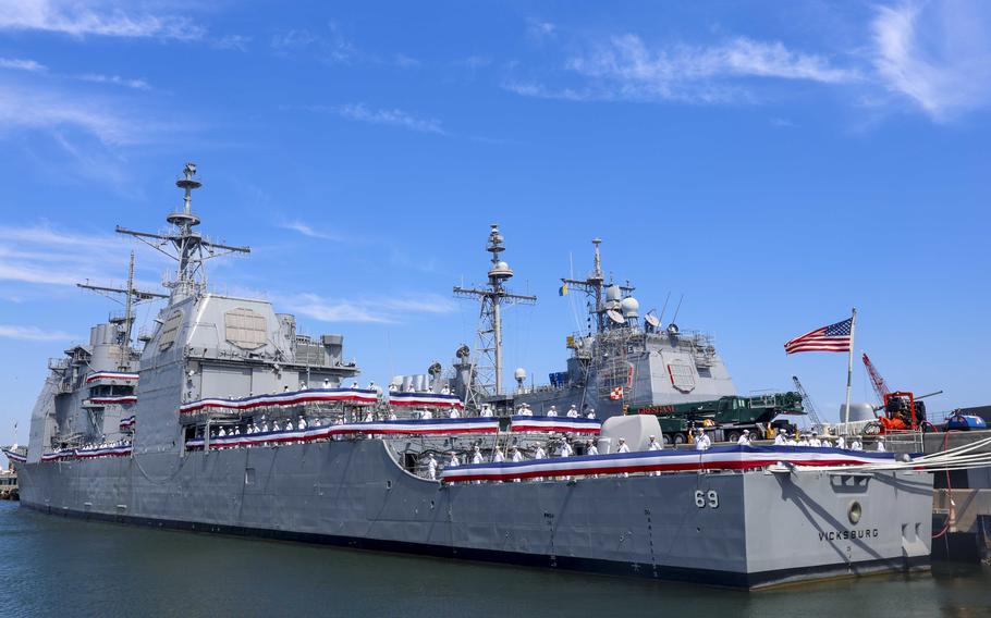 Sailors man the rails during the decommissioning ceremony of the guided-missile cruiser USS Vicksburg (CG 69), June 28, 2024, in Nolfolk, Va. The ceremony commemorated the history of the ship. 