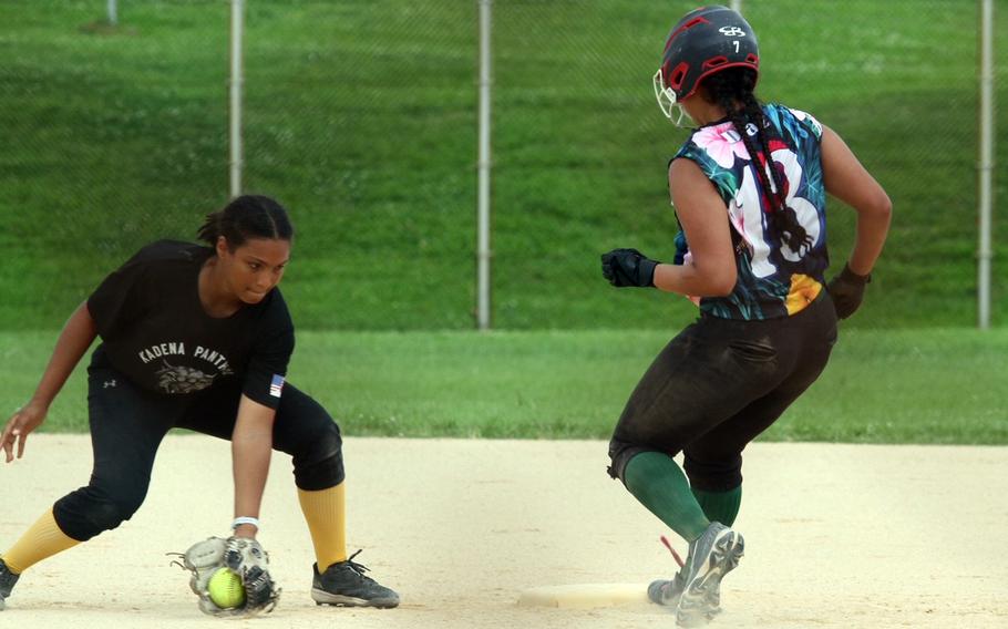 Kubasaki's Sam Diaz pulls into second base ahead of a tag by Kadena shortstop Jada Wolfgang during Monday's Division I softball tournament game. The Panthers beat the Dragons for the ninth time this season 9-3.