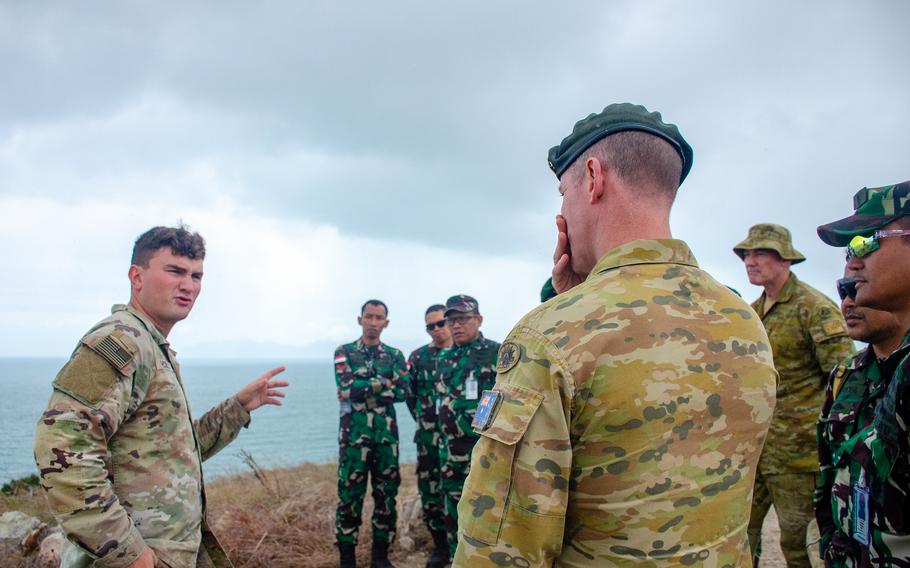 U.S. Army Lt. Jared McCully discusses a modular pier project with Australian and Indonesian troops in Bowen, Australia, July 27, 2023.