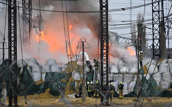 Firefighters extinguish a fire at an electrical substation after a missile attack in Kharkiv, on March 22, 2024, amid the Russian invasion in Ukraine. 