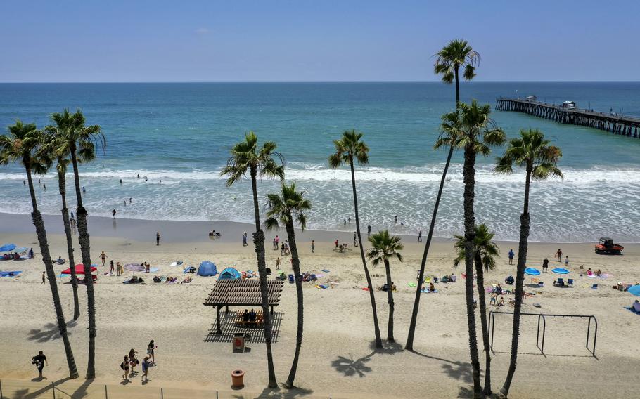 Three off-duty Marines were kicked and punched by 30 teenagers and young adults near the San Clemente Pier on Friday night, the Orange County Sheriff’s Department said. 