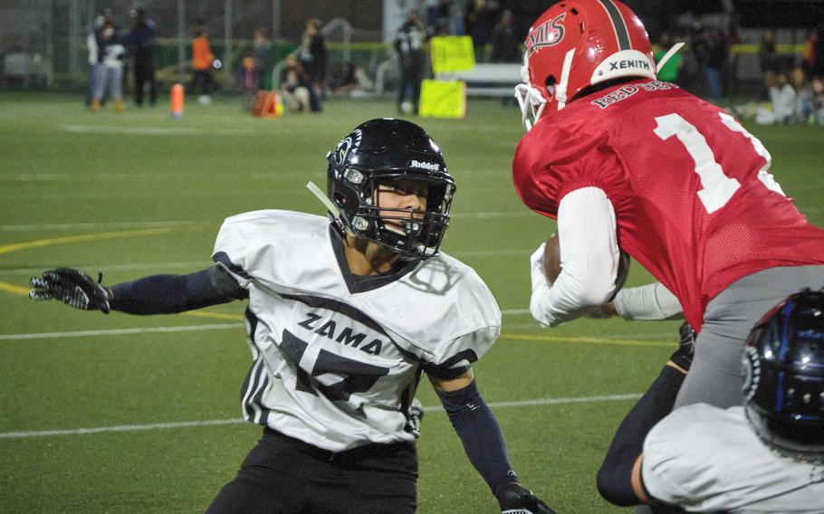 Kinnick's Ryo Nishiyama tries to evade Zama's Hiroki Davis.