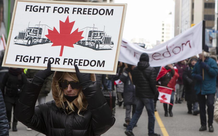 Protesters march in Toronto to voice their opposition to COVID-19 vaccine mandates on Saturday, Feb.  12, 2022. The demonstrations at the Ambassador Bridge, downtown Ottawa and elsewhere have targeted vaccine mandates and other coronavirus restrictions and vented fury toward Prime Minister Justin Trudeau, who has called the protesters a “fringe” element of Canadian society.