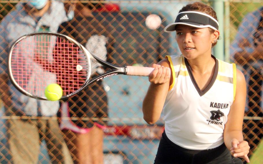 Kadena's Mayann Rivera slaps a forehand return against Kubasaki's Noemi Ung during Wednesday's Okinawa tennis matches. Rivera won 8-2.