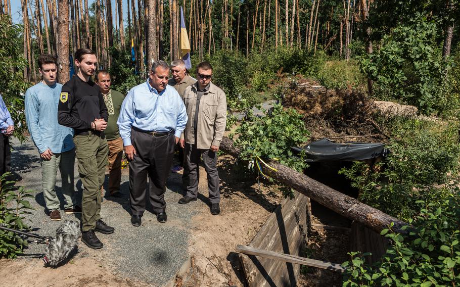 Republican presidential candidate Chris Christie looks at a trench in Moshchun, Ukraine, on Friday, Aug. 4,. 2023,  that was used during Russia’s offensive in March 2022. 