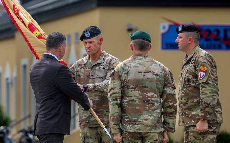 Tommy Mize, director of Installation Management Command-Europe passes the garrison colors to Col. Scott Horrigan, who assumed command of U.S. Army Garrison Italy
on June 22, 2023 during a ceremony in Vicenza, Italy.