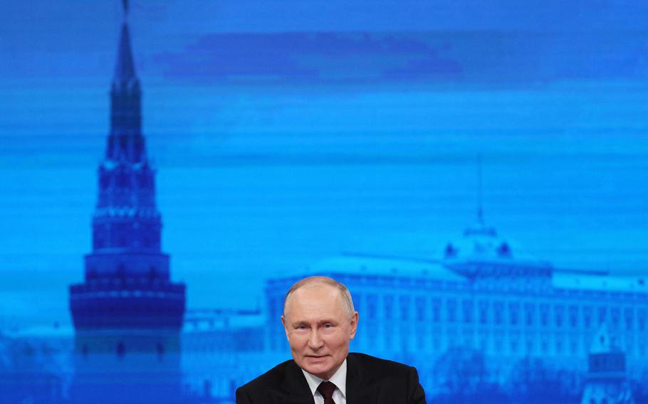 This pool photograph distributed by Russia’s state agency Sputnik shows Russian President Vladimir Putin holding his year-end press conference at Gostiny Dvor exhibition hall in central Moscow on Dec. 14, 2023. 