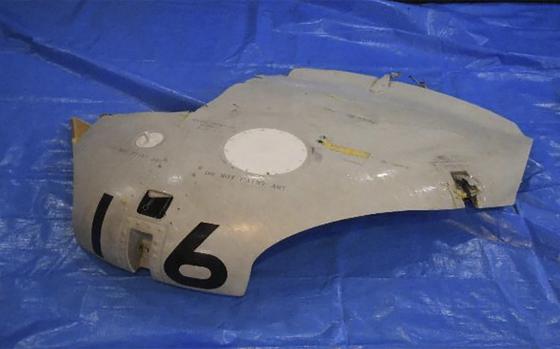 This image released by Japan Maritime Self-Defense Force shows a retrieved component which is believed to be a part of a crashed helicopter, Sunday, April 21, 2024. Initial analysis of flight data recorders recovered from the waters in the Pacific near the crash site of the two Japanese navy helicopters showed no sign that mechanical problems in the aircraft caused the accident, Japan’s defense minister said Monday, as he indicated human error.