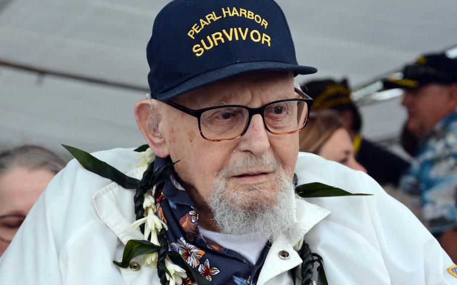 Ira Schab, 102, who was a musician aboard the USS Dobbin during the Dec. 7, 1941, attack on Pearl Harbor, awaits the beginning of a commemoration of the event at the Pearl Harbor National Memorial, Dec. 7, 2022.