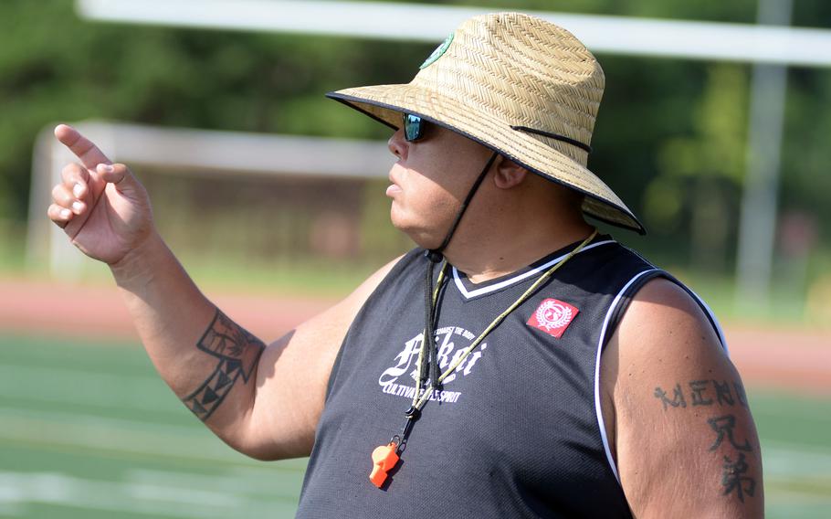 Reggie Meno talks in practice.