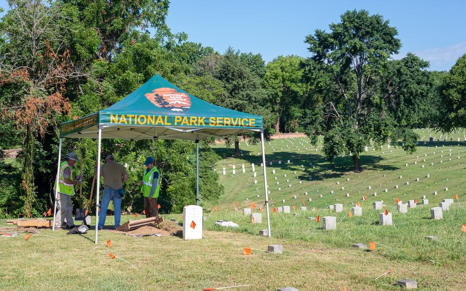 Archaeologists from the Northeast Archeological Resources Program test the proposed location for a new gravesite in the Fredericksburg National Cemetery.