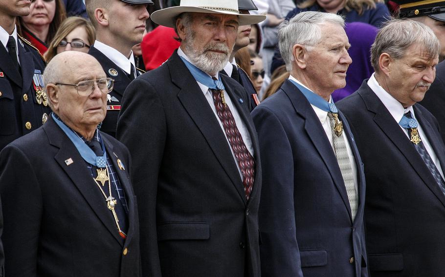 Hershel "Woody" Williams, left, and other Medal of Honor recipients listen during a ceremony at Arlington National Cemetery in March, 2009.