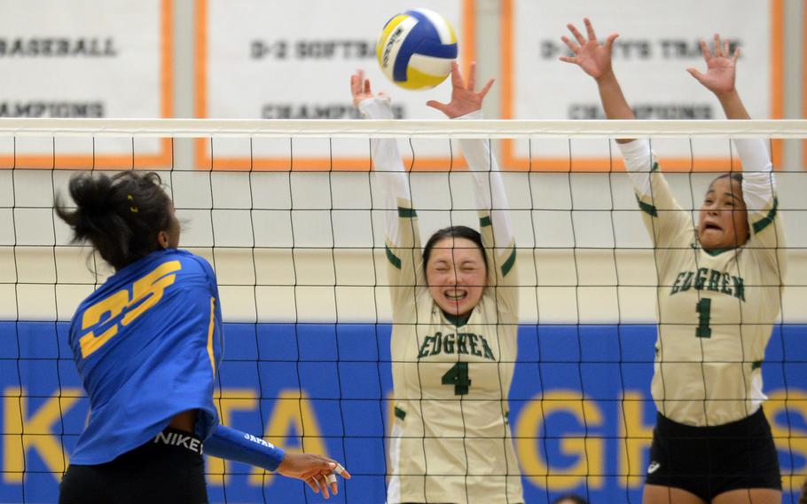 Yokota's Trinity Stegall spikes past the double block of Robert D. Edgren's Milan Bean and Zalea Washington during Saturday's DODEA-Japan volleyball match. The Panthers won in five sets, splitting their weekend series with the Eagles.