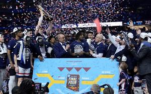 UConn celebrates after defeating Purdue on April 8, 2024, to win the national championship.