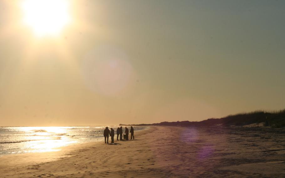 Sunset Beach in the Brunswick Islands. The Brunswick Islands run east and west, and in the fall and winter, the sun tilts so that visitors are uniquely afforded sunrises and sunsets over the water. 