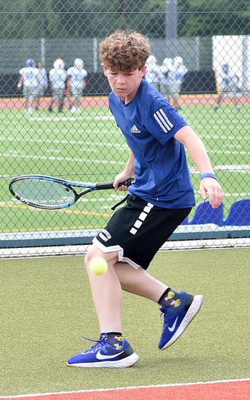Royal tennis player Will Singletary prepares to hit the ball during an Aug. 29, 2023, practice at Ramstein High School on Ramstein Air Base, Germany.