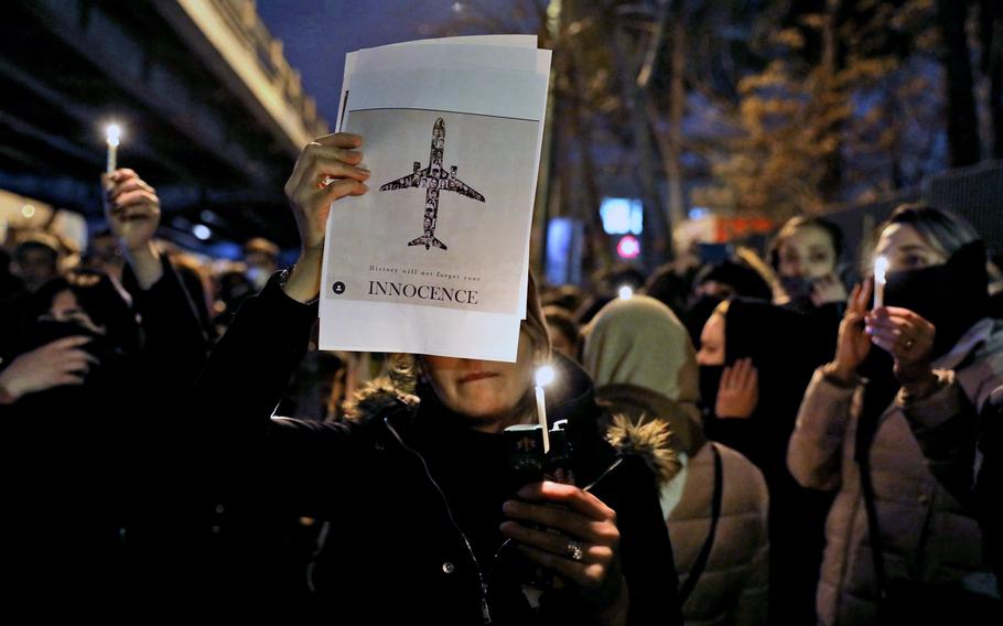 People gather for a candlelight vigil in Tehran, Iran, on Jan. 11, 2020, as they remember the victims of a Ukraine plane crash. According to reports on Tuesday, Jan. 4, 2022, a court in Canada has ruled that Iran should pay $107 million in punitive damages to families of six people with Canadian citizenship or residency who were killed in the Iranian military’s downing of a Ukrainian passenger plane in 2020.