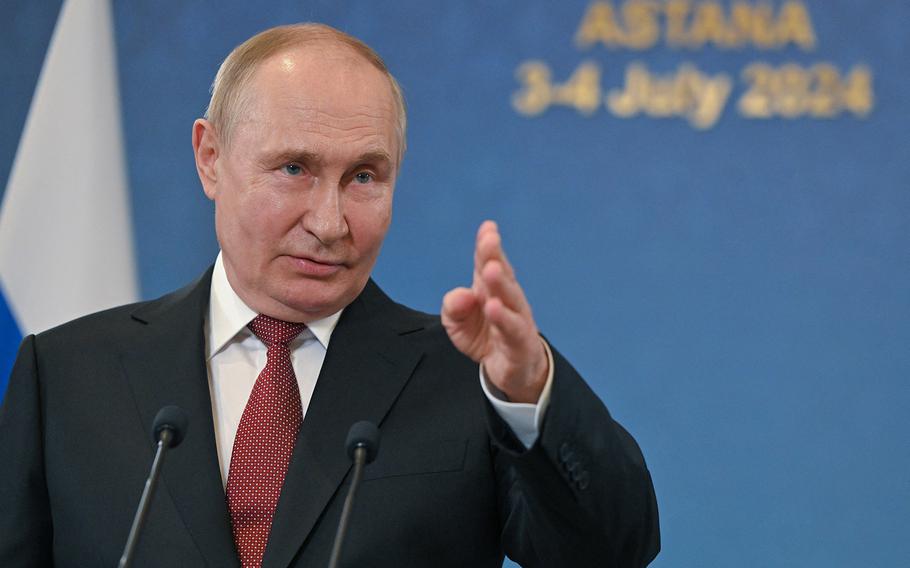 Russia President Vladimir Putin answers questions from the news media.