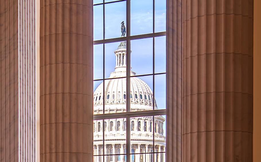 The U.S. Capitol is seen through a Cannon House Office Building window on Wednesday, Dec. 13, 2023.
