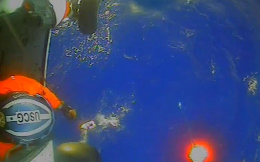 The Coast Guard rescues four Canadians from capsized catamaran 150 miles offshore of North Carolina on Oct. 21, 2023.